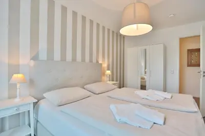 Ein Bett oder Betten in einem Zimmer der Unterkunft Kurparkresidenz Kurparkresidenz Appartement 4