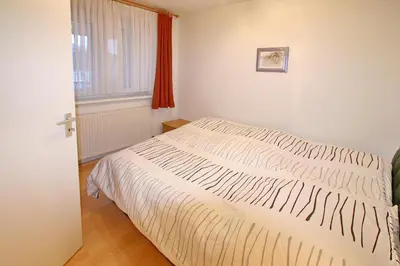 Ein Bett oder Betten in einem Zimmer der Unterkunft Seebrücke Seebrücke Appartement 7