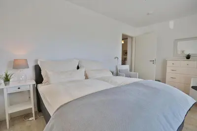 Ein Bett oder Betten in einem Zimmer der Unterkunft Strandglück Haus C Strandglück Appartement 7C