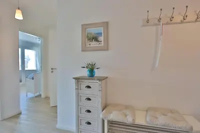 Ein Bett oder Betten in einem Zimmer der Unterkunft Strandglück Haus C Strandglück Appartement 7C