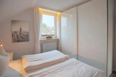 Ein Bett oder Betten in einem Zimmer der Unterkunft Doppelhaushälfte Am Knurrhahn Am Knurrhahn Appartement 2