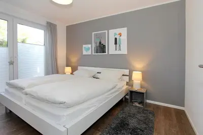 Ein Bett oder Betten in einem Zimmer der Unterkunft Haus am Hörn Tide am Hörn