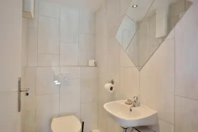Ein Badezimmer in der Unterkunft Haus Oceanfront, Appartement 11