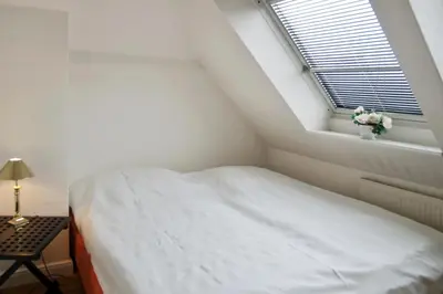 Ein Bett oder Betten in einem Zimmer der Unterkunft Seebrücke Seebrücke Appartement 27