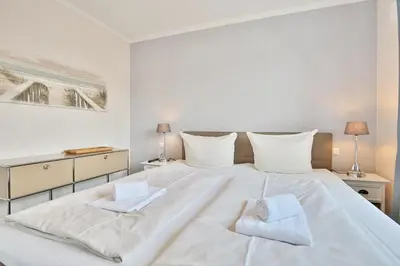 Ein Bett oder Betten in einem Zimmer der Unterkunft Strandvilla Augustusbad Strandvilla Augustusbad Appartement Riverside