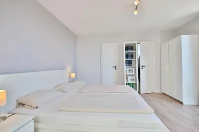 Ein Bett oder Betten in einem Zimmer der Unterkunft Haus Adria Haus Adria Appartement 29