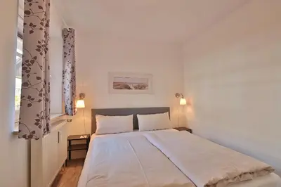 Ein Bett oder Betten in einem Zimmer der Unterkunft Parkresidenz Parkresidenz Appartement 4