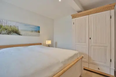 Ein Bett oder Betten in einem Zimmer der Unterkunft Haus Meeresbrise Haus Meeresbrise Appartement 7