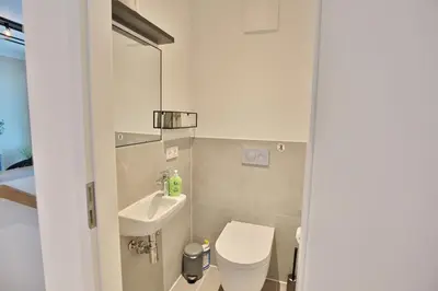 Ein Badezimmer in der Unterkunft View 91 Ferienwohnung Dünenblick App 1