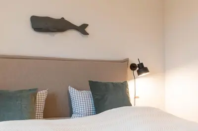 Ein Bett oder Betten in einem Zimmer der Unterkunft Ferienwohnung Ahoi Scharbeutz
