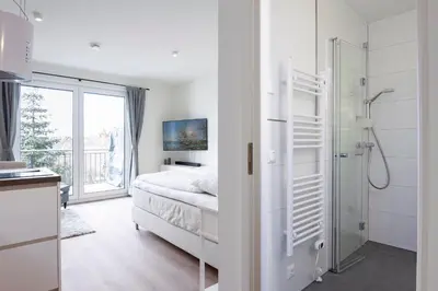 Ein Bett oder Betten in einem Zimmer der Unterkunft Pier 67 Kleine Perle Neustadt