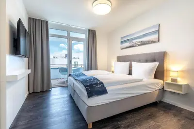 Ein Bett oder Betten in einem Zimmer der Unterkunft Godewindpark Travemünde Godewindpark Travemünde 3-07