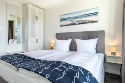 Ein Bett oder Betten in einem Zimmer der Unterkunft Godewindpark Travemünde Godewindpark Travemünde 3-17