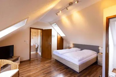Ein Bett oder Betten in einem Zimmer der Unterkunft MEI27a Ferienwohnung Ostseetraum