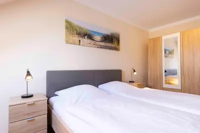 Ein Bett oder Betten in einem Zimmer der Unterkunft MEI27a Ferienwohnung Ostseetraum
