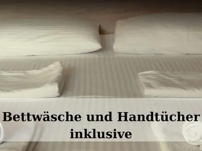 Ein Bett oder Betten in einem Zimmer der Unterkunft Top - Seaside Appartement mit Meerblick