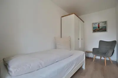 Ein Bett oder Betten in einem Zimmer der Unterkunft Am Elchgrund Am Elchgrund 7 Appartement 2