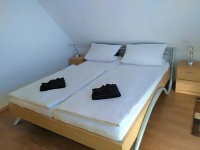 Ein Bett oder Betten in einem Zimmer der Unterkunft Bahnhofsweg 12