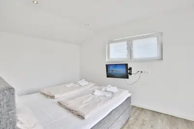 Ein Bett oder Betten in einem Zimmer der Unterkunft Bungalow am Karkstieg Bungalow Jacobsmuschel