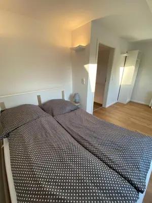 Ein Bett oder Betten in einem Zimmer der Unterkunft Ferienhaus Wesloer Landstraße 6a für 4 Personen