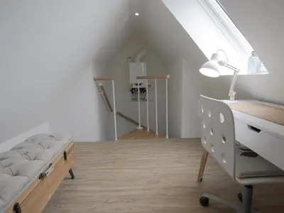 Ein Bett oder Betten in einem Zimmer der Unterkunft Ferienwohnung Nordic Nature Loft in Travemünde direkt in der Vorderreihe inkl Privatsauna