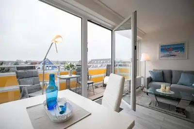 Ein Sitzbereich in der Unterkunft Strandhotel Scharbeutz Dünenliebe