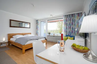 Ein Bett oder Betten in einem Zimmer der Unterkunft Seetempel Wohnung 23