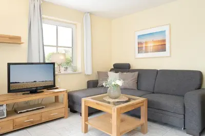 TV/Unterhaltungsangebot in der Unterkunft Strandallee 92b- Wohnung 18