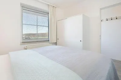 Ein Bett oder Betten in einem Zimmer der Unterkunft Strandresidenz Lütte Deern 10