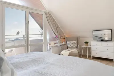 Ein Bett oder Betten in einem Zimmer der Unterkunft Strandburg Strandperle Scharbeutz
