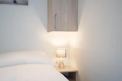 Ein Bett oder Betten in einem Zimmer der Unterkunft Ostseecamp Lübecker Bucht Ferienhaus 