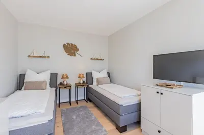 Ein Bett oder Betten in einem Zimmer der Unterkunft BLACK PEARL Penthouse Black Pearl