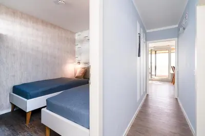 Ein Bett oder Betten in einem Zimmer der Unterkunft Ferienpark Sierksdorf App 111 - Strandlage