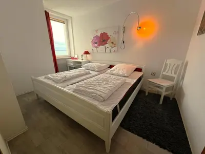 Ein Bett oder Betten in einem Zimmer der Unterkunft Ferienpark Sierksdorf App 320 - Strandlage