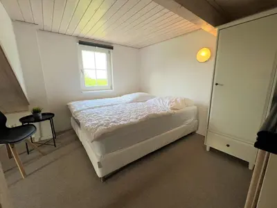 Ein Bett oder Betten in einem Zimmer der Unterkunft Strandpark Sierksdorf H080