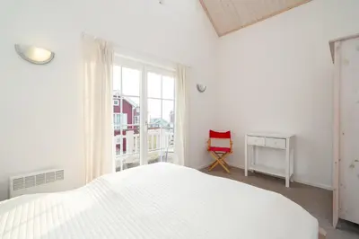 Ein Bett oder Betten in einem Zimmer der Unterkunft Strandpark Sierksdorf H056