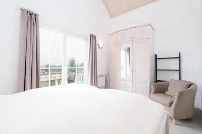 Ein Bett oder Betten in einem Zimmer der Unterkunft Strandpark Sierksdorf H090