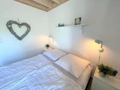 Ein Bett oder Betten in einem Zimmer der Unterkunft Strandpark Sierksdorf H008