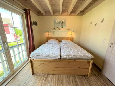 Ein Bett oder Betten in einem Zimmer der Unterkunft Strandpark Sierksdorf H092 