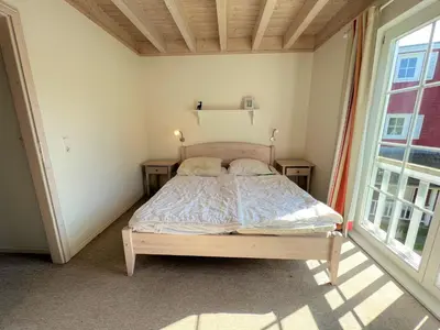 Ein Bett oder Betten in einem Zimmer der Unterkunft Strandpark Sierksdorf H079