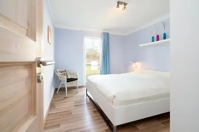 Ein Bett oder Betten in einem Zimmer der Unterkunft Strandpark Sierksdorf H023
