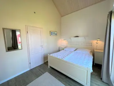 Ein Bett oder Betten in einem Zimmer der Unterkunft Strandpark Sierksdorf H054