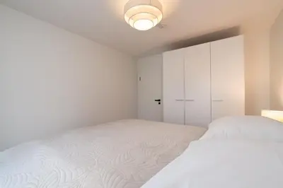 Ein Bett oder Betten in einem Zimmer der Unterkunft Strandpark Sierksdorf H024