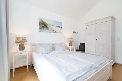 Ein Bett oder Betten in einem Zimmer der Unterkunft Strandpark Sierksdorf H059