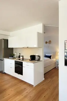 Küche/Küchenzeile in der Unterkunft Gemütliche Ferienwohnung mit Meerblick und Terrasse - Nur 50 Meter zum Strand inklusive Parkplatz und Fahrradunterstellplatz