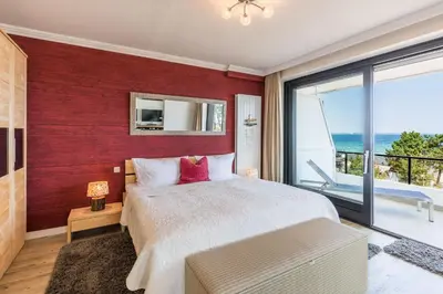 Ein Bett oder Betten in einem Zimmer der Unterkunft Herzbergs Ferienwohnung Meersehen