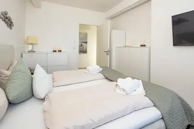 Ein Bett oder Betten in einem Zimmer der Unterkunft Ostsee Suite 1 - Strandperle