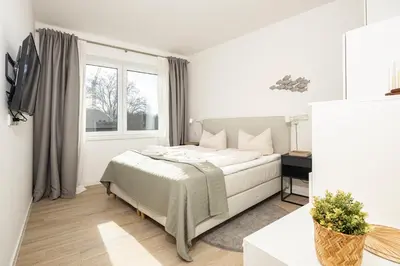 Ein Bett oder Betten in einem Zimmer der Unterkunft Ostsee Suite 3 - Strandperle