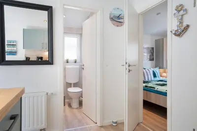 Ein Badezimmer in der Unterkunft Ostseecamp Lübecker Bucht Casa del Mar mit kostenfreier Saunanutzung