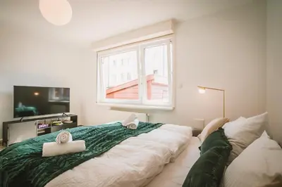 Ein Bett oder Betten in einem Zimmer der Unterkunft Sadebo Modern City Lübeck - Balkon oder Terrasse